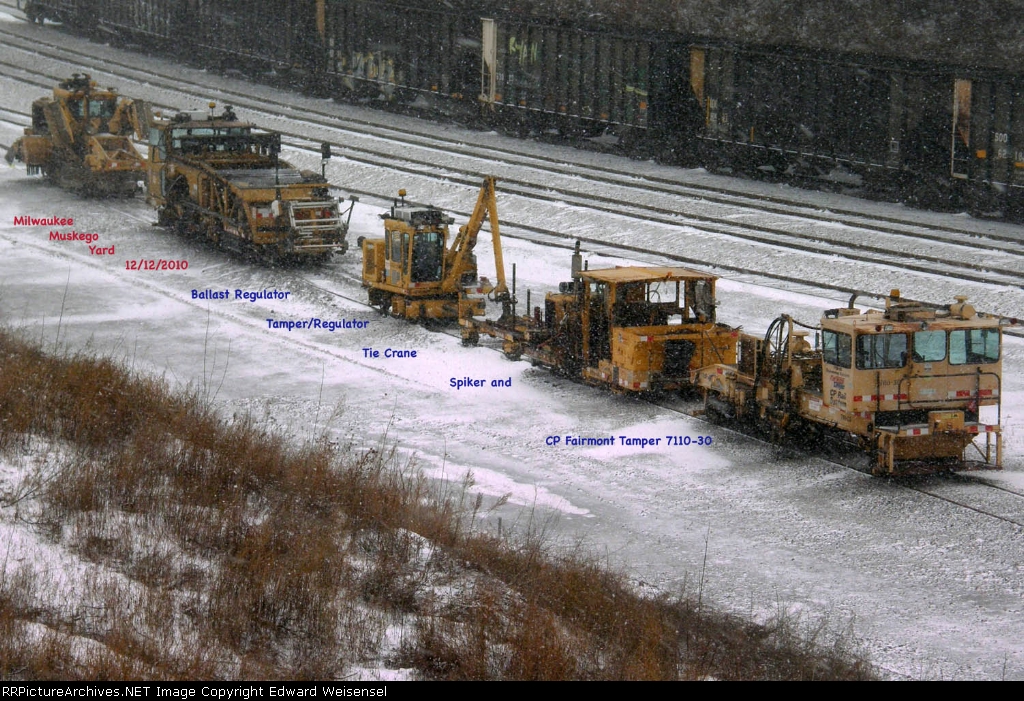 Fairmont Tamper 7110-30 holds down track 8 of the Harvester Yard with 4 friends